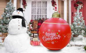 Detail of red 60cm inflatable PVC Christmas ball with LED lights in a festive snow scene
