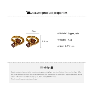 Detailed size specifications and view of twisted gold-plated hoop earrings with brown resin