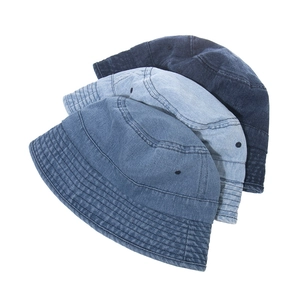 Three denim bucket hats in various blue shades showing detailed stitching and fabric texture
