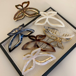 Set of 6 butterfly acetate hair claws in various marble colors with gold metal springs