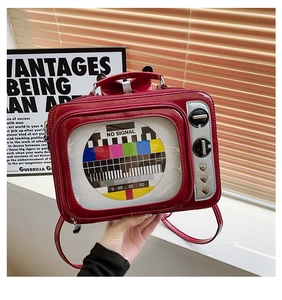 Detail of red vintage TV shaped bag with clear window and heart-shaped metal rivets