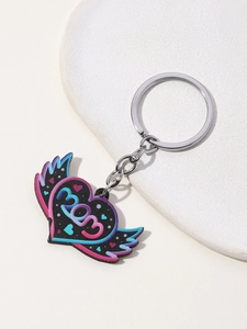 Macro shot of winged heart MOM keychain with pink and blue neon gradient design