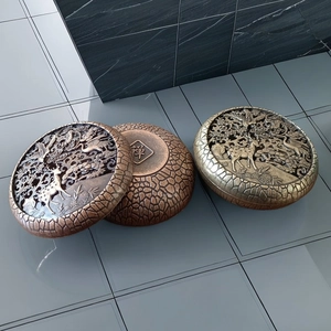 Vue détaillée montrant la gravure du caractère Zen et la texture en bronze du brûle-encens