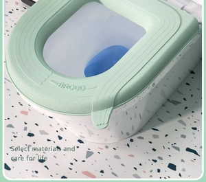 Close-up of waterproof light green EVA toilet seat cover with stylish terrazzo pattern base