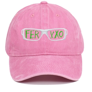 Close-up of green FERXXO embroidery on peach pink washed cotton baseball cap