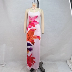 Close-up of pink floral dress with vibrant lily prints and adjustable spaghetti straps