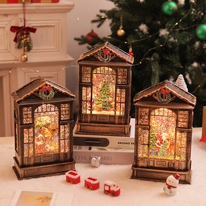 Detailed view of three vintage Christmas lanterns with LED lights and festive scenes