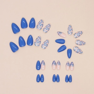 Short almond press-on nails set featuring royal blue and floral french tip designs
