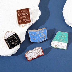 Set of 5 enamel book pins in various colors with creative literary quotes