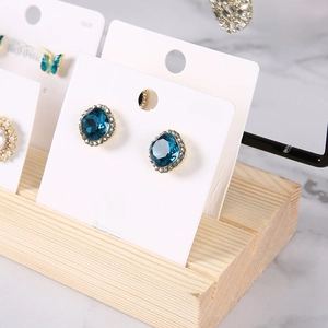 Blue gemstone earrings with 144-hole display stand on white s925 silver needle cards
