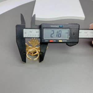 Detailed measurement showing an adjustable gold heart ring diameter at 21.8mm with caliper