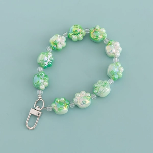 Cute green cat paw bead keychain with transparent floral accents and metal swivel clasp