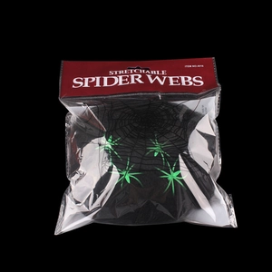 Detail of 20g stretchable spider web pack with green spiders for Halloween decoration
