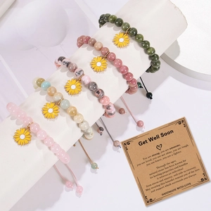 Five handmade natural stone bracelets with sunflower pendants and healing message card