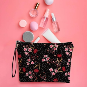 Trousse de maquillage florale avec fermeture éclair et dragonne sur fond rose