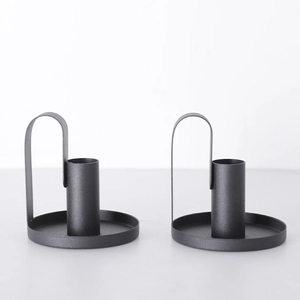 Set of two black iron candle holders with minimalist ring handle and matte finish