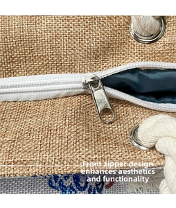 Detailed close-up of tote bag with linen texture, silver metal zipper, and sturdy cotton rope