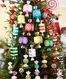 Close-up of colorful electroplated candy-shaped ornaments on a Christmas tree