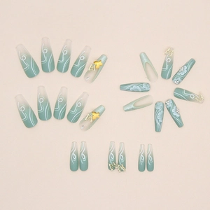 Long coffin press-on nails with matcha green gradient, 3D golden butterfly and floral art