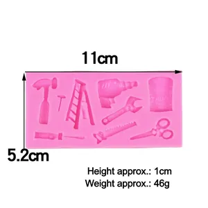 Pink silicone hardware tools mold featuring hammer and drill shapes for cake decor