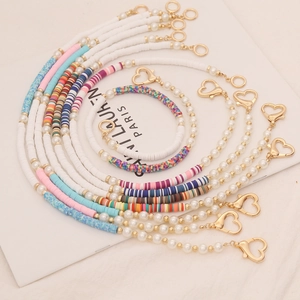 Bohemian colorful heishi clay bead and pearl necklace with golden heart clasp fastener