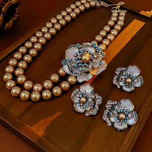 Vintage double-layer pearl necklace and floral enamel earrings set in French luxury style