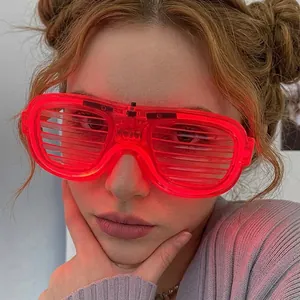 Close-up of red LED shutter glasses with glowing light bars for music festivals