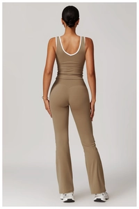 Back view of a taupe workout set featuring a racerback top and flared yoga leggings