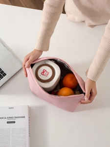 Pink waterproof lunch bag showing large capacity for food containers and fruits