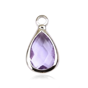 Macro shot of a teardrop-shaped amethyst pendant with a silver metal base and loop