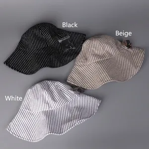 Cappelli da sole in lino a righe da donna nei colori nero, beige e bianco con sottogola