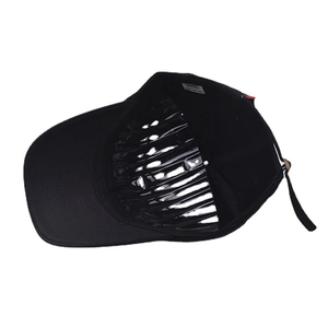 Detail view of the black cotton baseball cap interior with white label and inner support