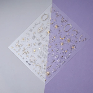 Detailed macro view of Co-105 embossed gold and white sun moon star nail stickers