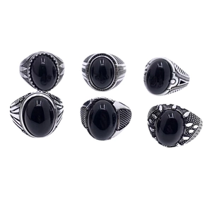 Set of six vintage stainless steel men's rings featuring black stones and boho carvings