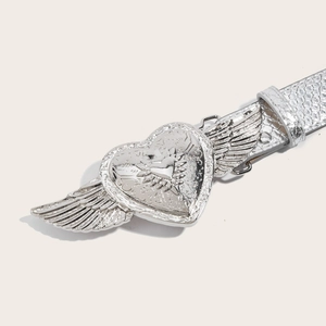 Silver faux leather belt with a textured strap and a wing-shaped heart buckle in relief