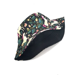 Black bucket hat featuring white unicorn and vibrant tropical floral prints for outdoor sun protection