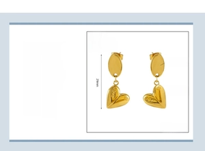 Detail view of 29mm gold-plated stainless steel heart earrings with LOVE engraving