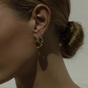 Chic 18k gold plated stainless steel teardrop earrings on a model for a luxury look
