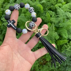 Leopard print silicone beaded keychain with black Jesus cross and long tassel charm