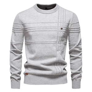 Close-up of light grey crew neck knit sweater texture and size label detail
