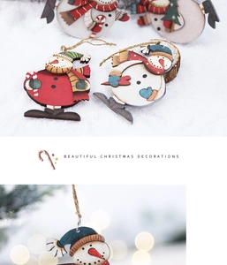 Detailed view of handcrafted wooden snowman ornaments for festive Christmas tree decoration