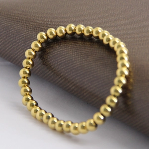 Minimalist 15mm golden stainless steel bead elastic ring with a polished mirror finish