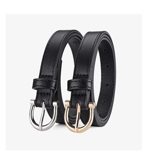 Detail of slim black belts with elegant silver and gold U-shaped metal buckles