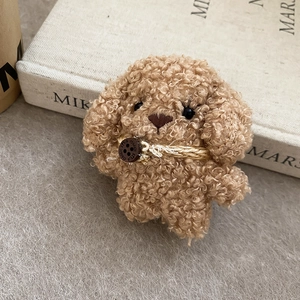 Close-up of curly brown teddy dog hair accessory with classic style wooden button