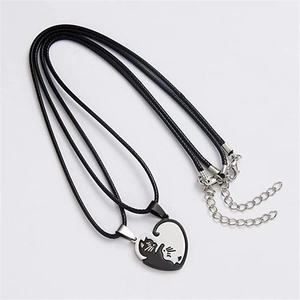 Close-up of titanium steel cat heart pendant necklace with black cord and metal chain