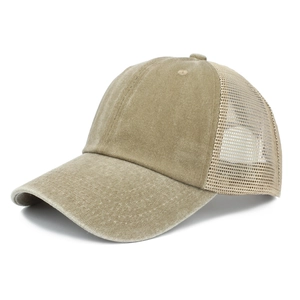 Detail view of khaki washed cotton fabric and breathable mesh on this trucker cap