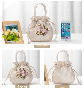 Detailed views and size comparison of a beige satin handbag with floral embroidery