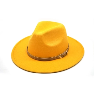 Close-up of ginger yellow wool fedora hat featuring a brown leather belt with gold buckle
