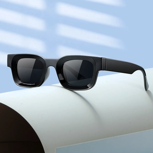 Chic black thick frame square sunglasses on light blue background with artistic shadows