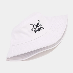 Close-up of white cotton bucket hat featuring Cat Mom embroidery and cat ears design